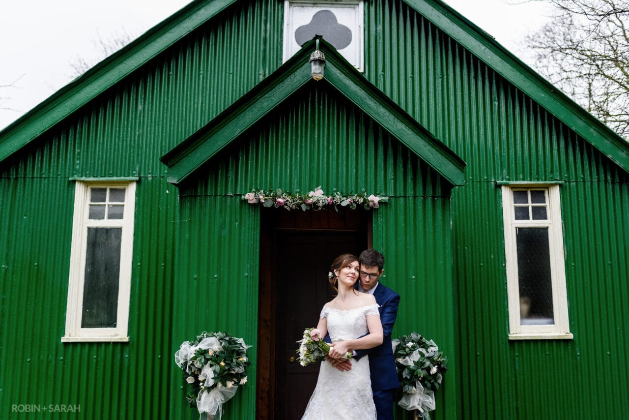and groom together outside Mission Church at Avoncroft Museum