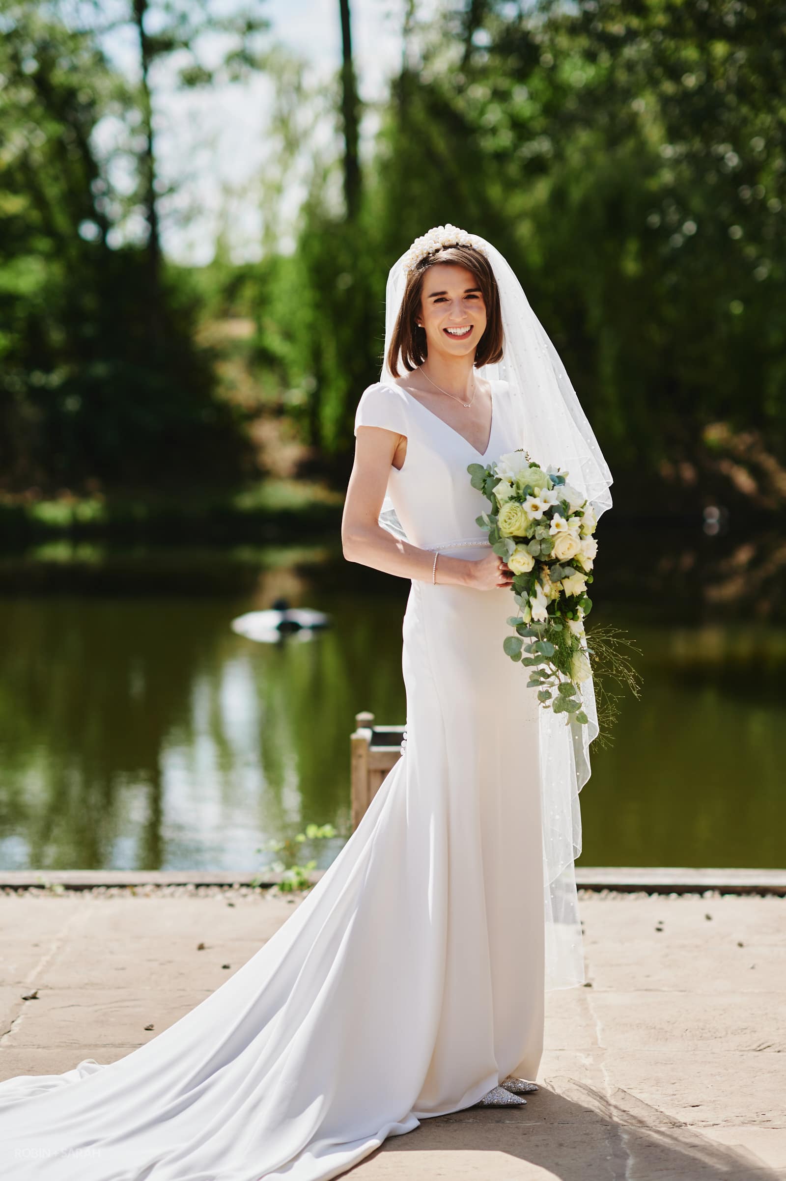 Portrait of bride in beautiful wedding dress with flowing veil