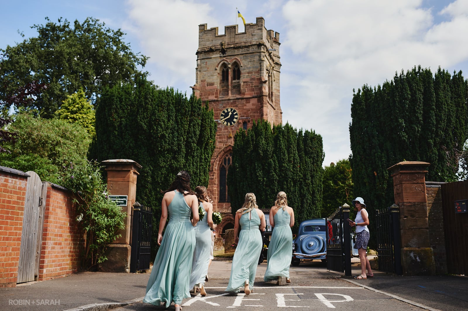 Bridesmaids arrive at Bride arrives at St Peter's church Dunchurch for wedding ceremony for wedding ceremony