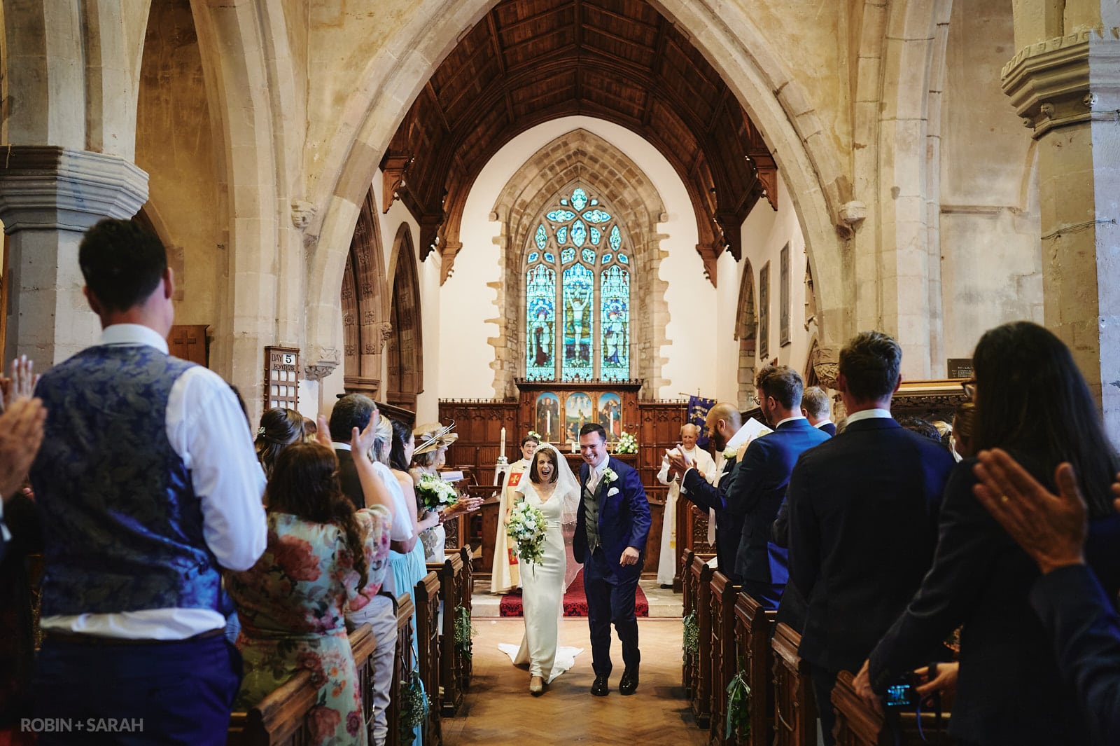 Bride and groom exit St Peter's church Dunchurch