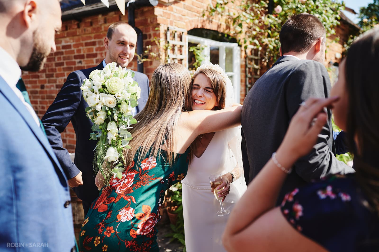 Guests relax and congratulate couple during wedding drinks reception at Wethele Manor