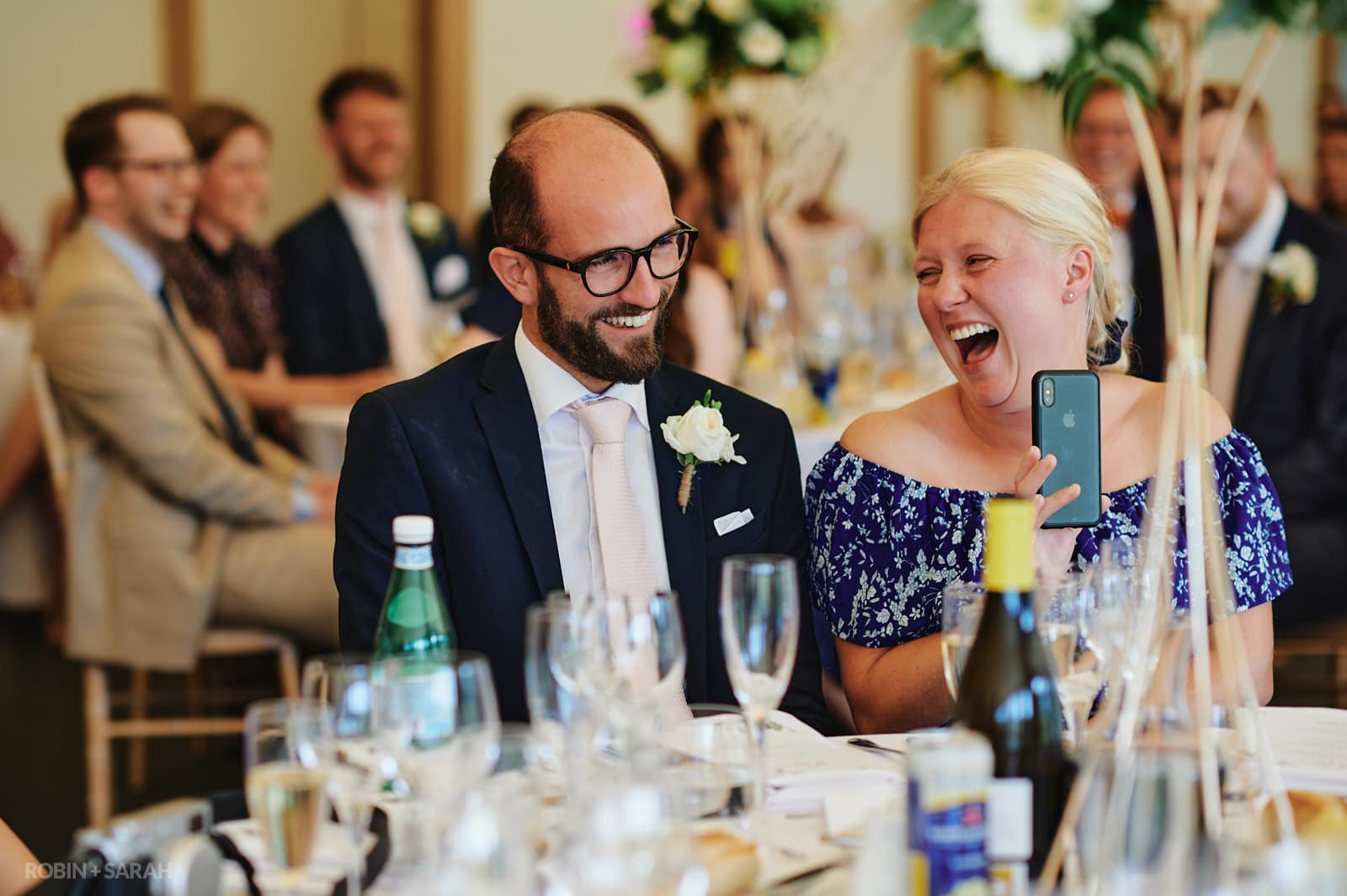 Wedding guests laughing during speeches