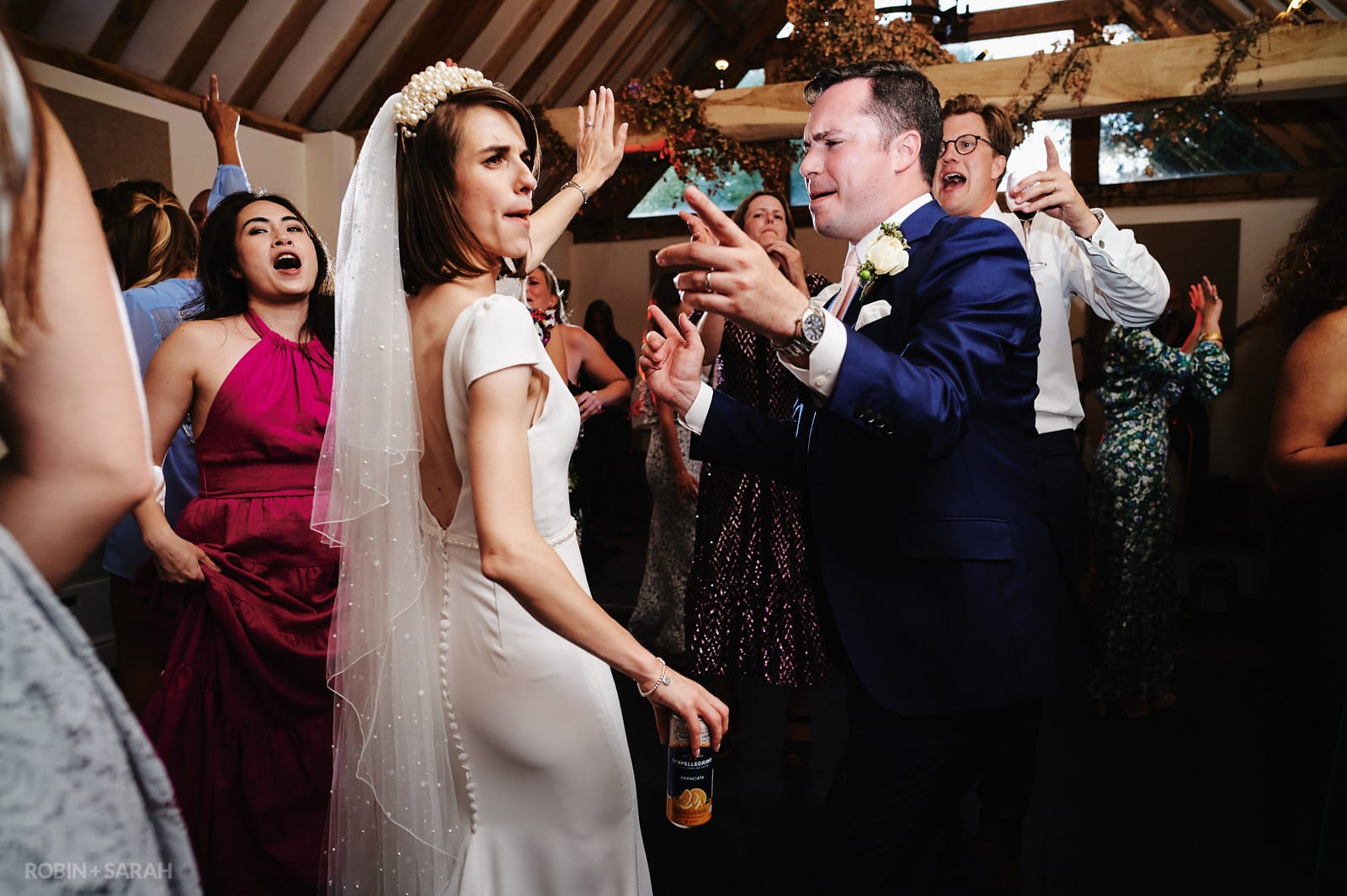 Bride, groom and guests dancing at Wethele Manor wedding.