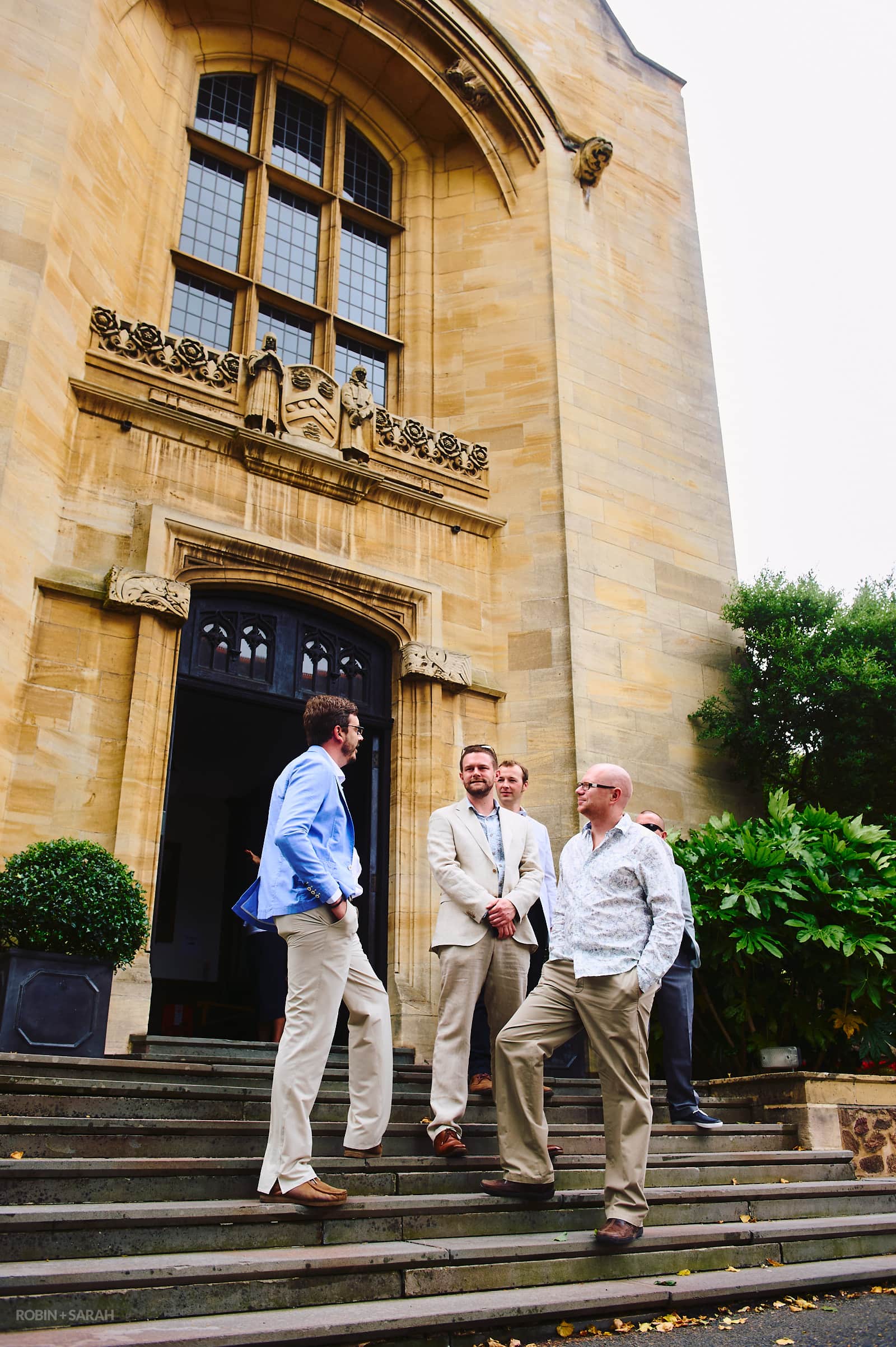 Groom and friends wait outside Malvern College Memorial Library