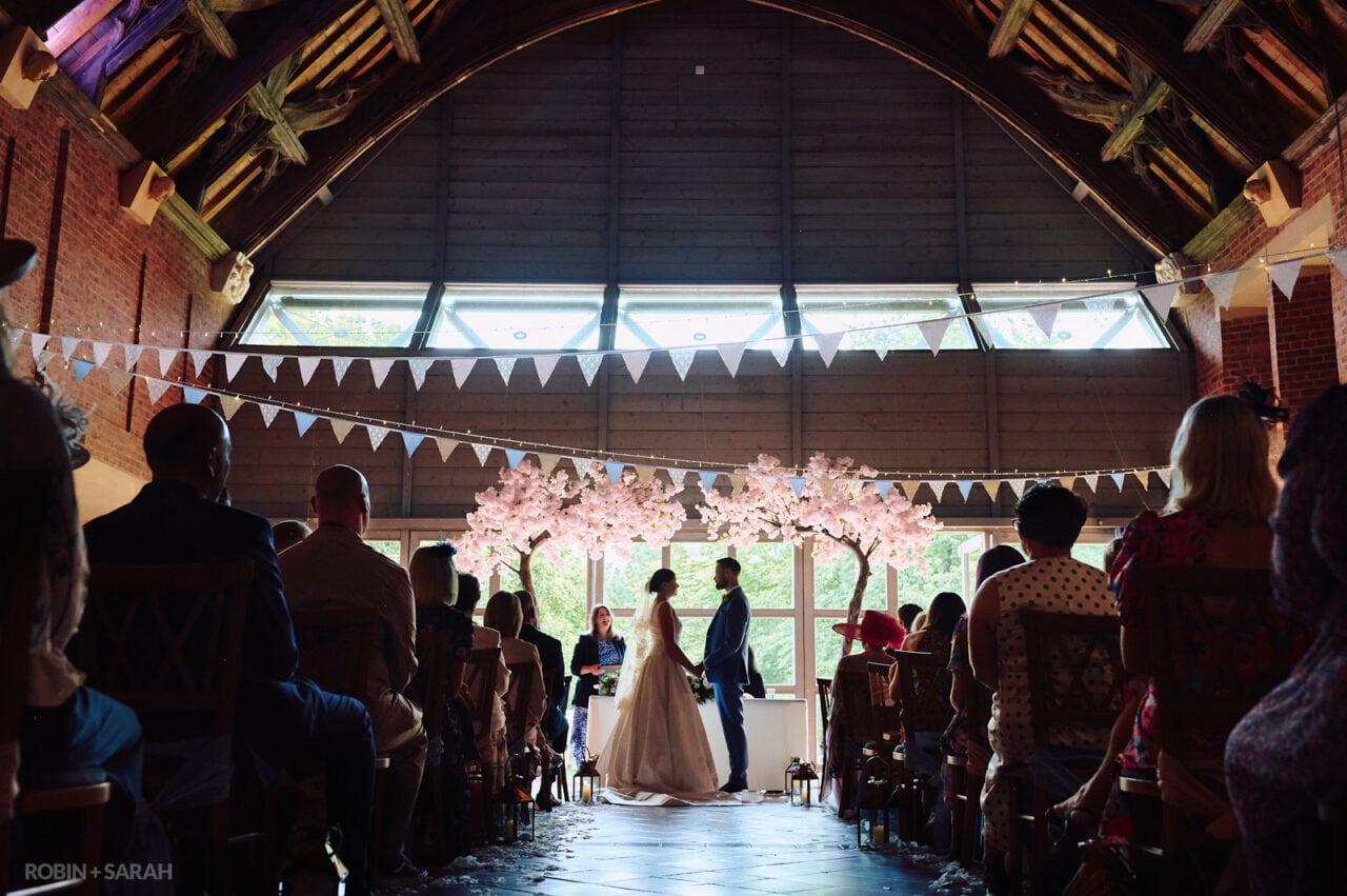Wide view of wedding ceremony in Guesten Hall at Avoncroft Museum