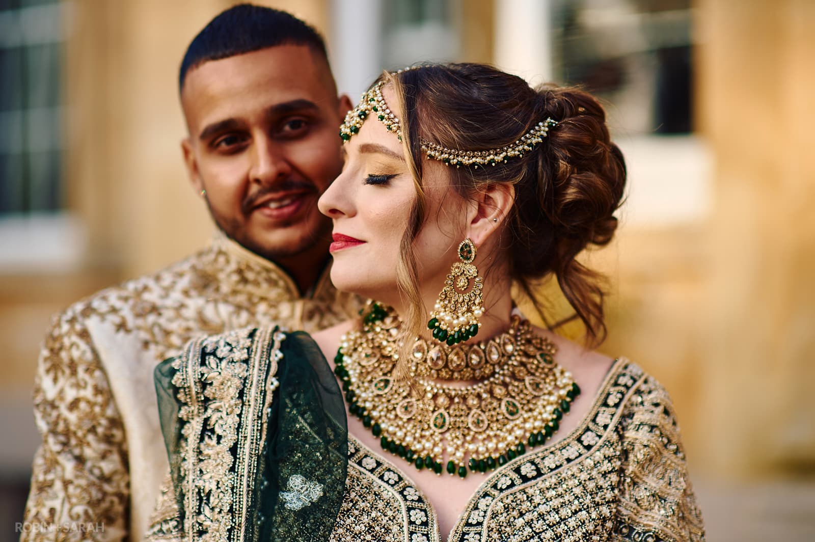 Bride and groom in Indian wedding outfits at Spring Grove House