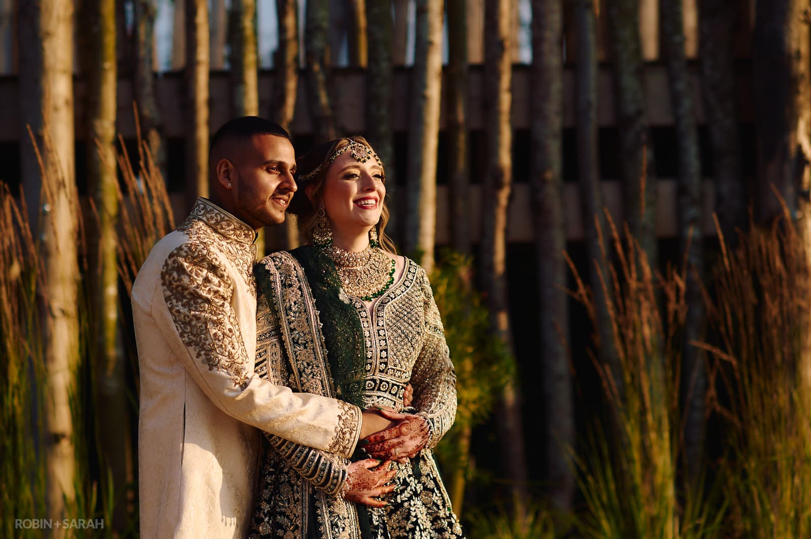 Bride and groom in Indian wedding outfits enjoy the sunshine at West Midlands Safari Park
