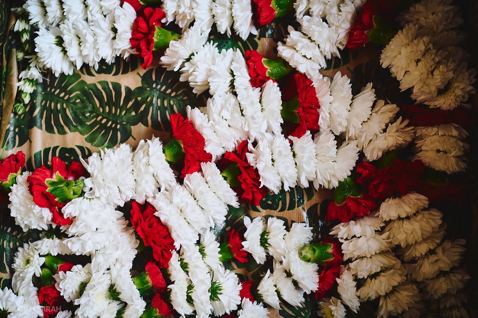 Garlands of red and white Indian wedding flowers