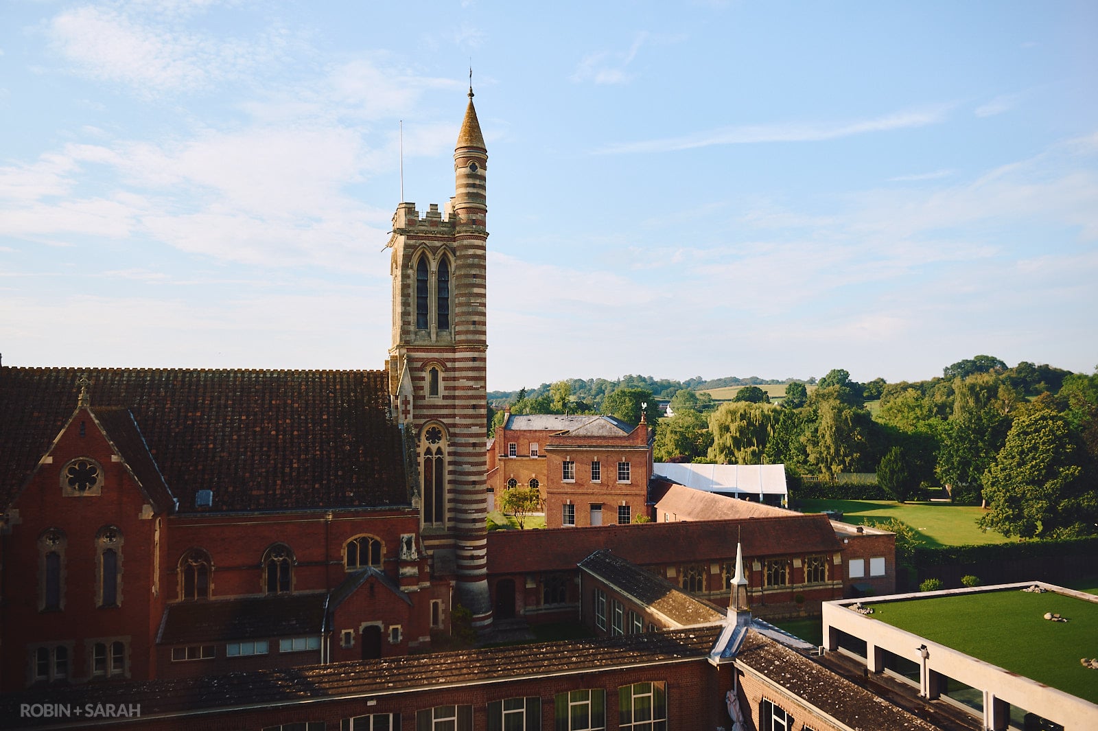 View of Stanbrook Abbey bell tower from hotel room with rolling hills in the distsance