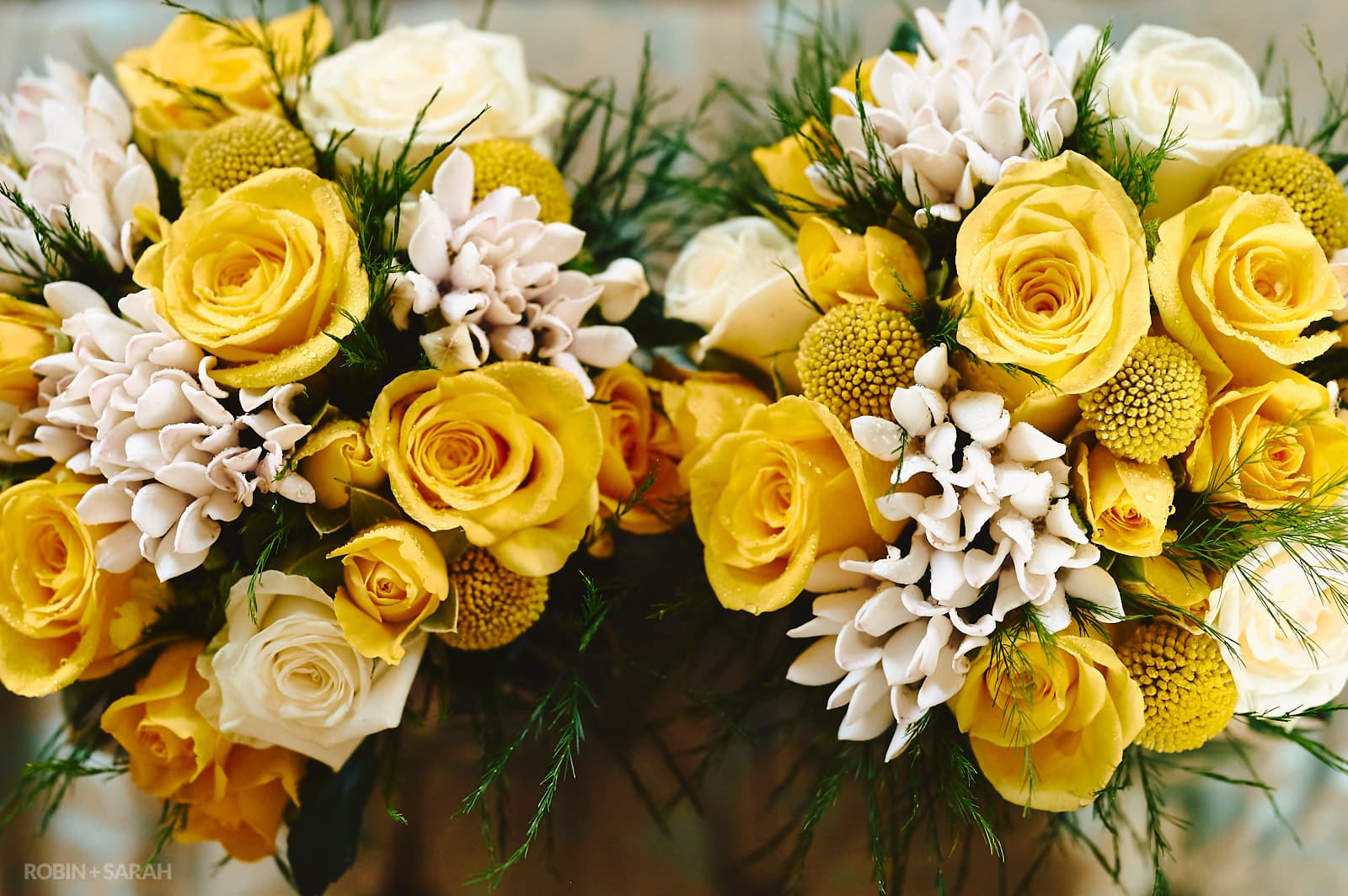 Detail of bridesmaids bouquets, with white and yellow flowers