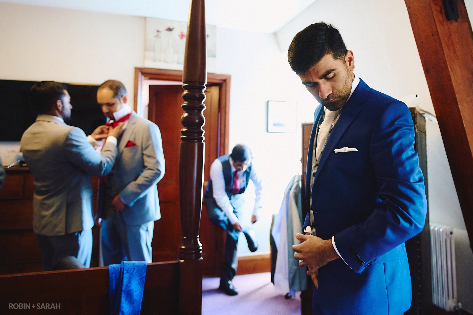 Groom and groomsmen prepare for wedding