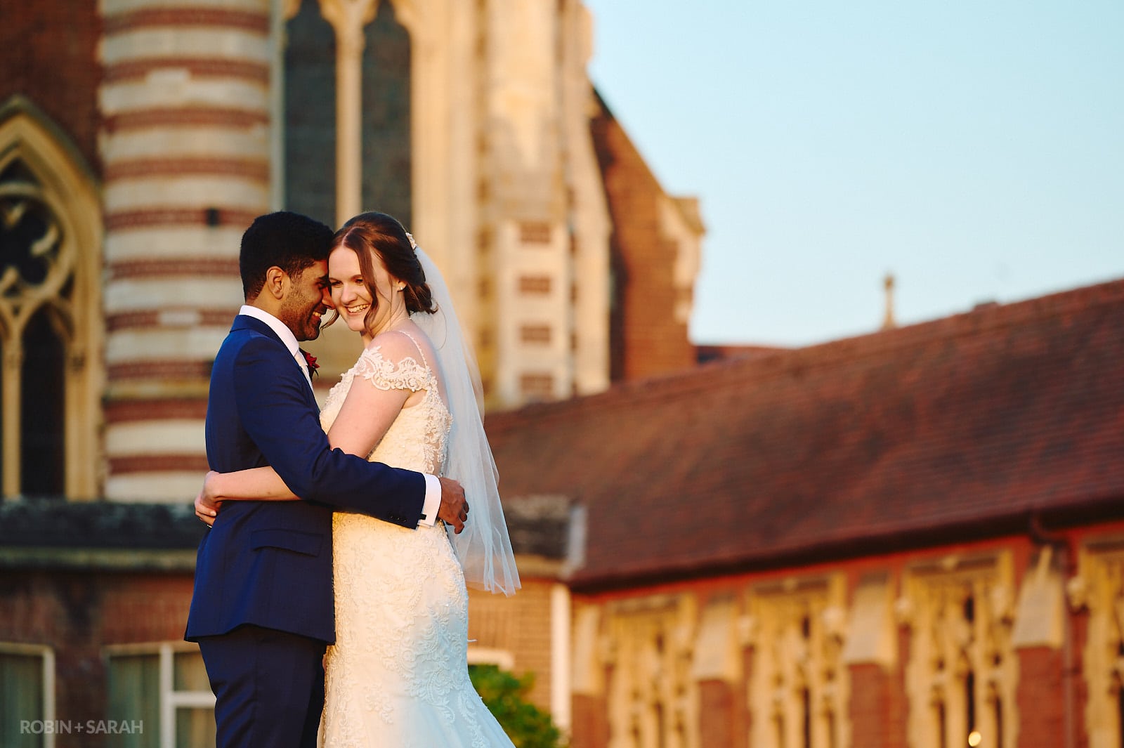 Bride and groom in front of Callow Great Hall at Stanbrook Abbey
