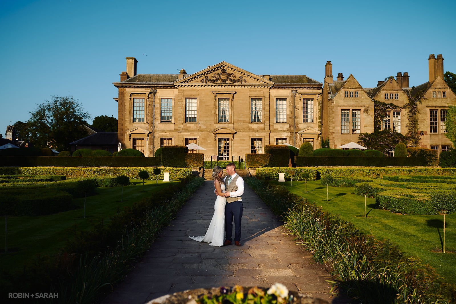 Bride and groom in grounds at Coombe Abbey