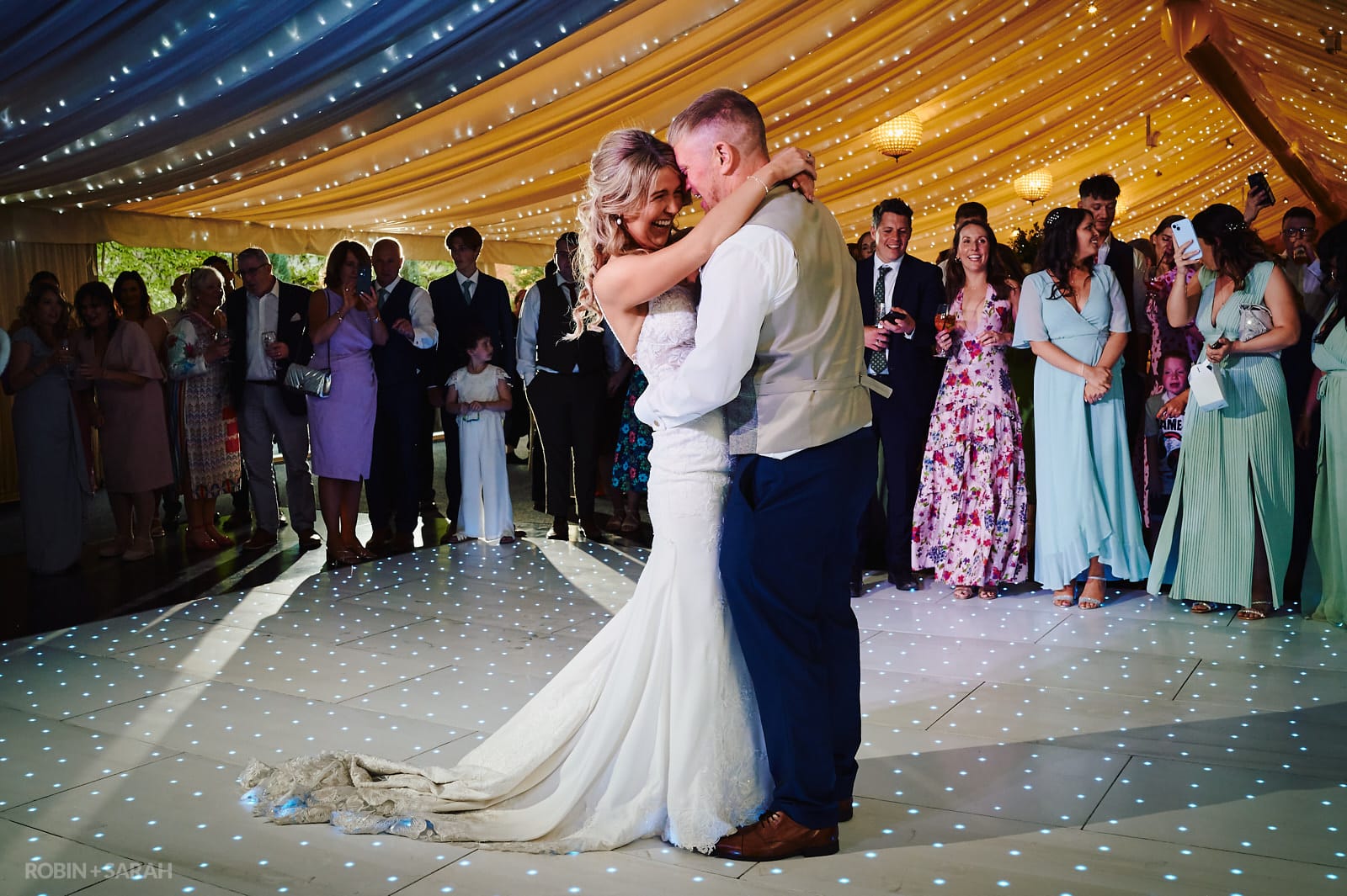 Bride and groom first dance in marquee at Coombe Abbey