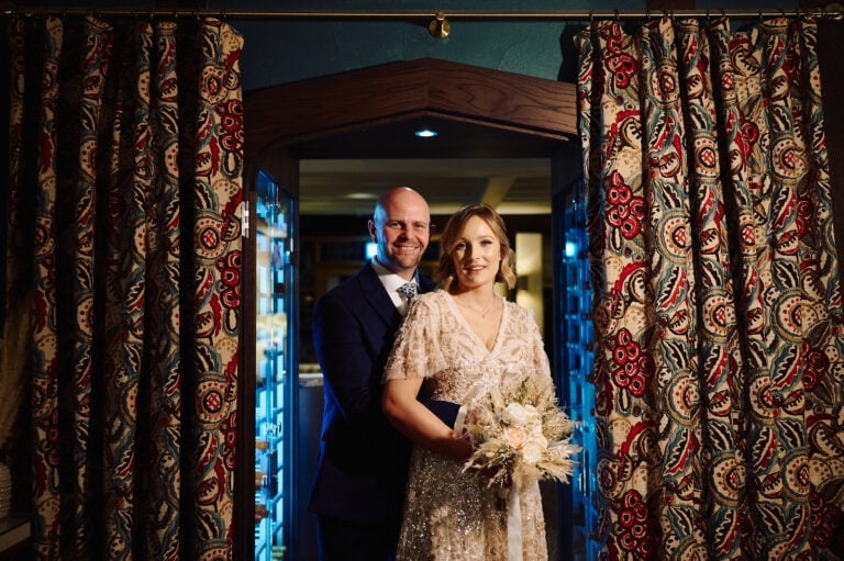Bride and groom in parlour room at Hogarths Stone Manor