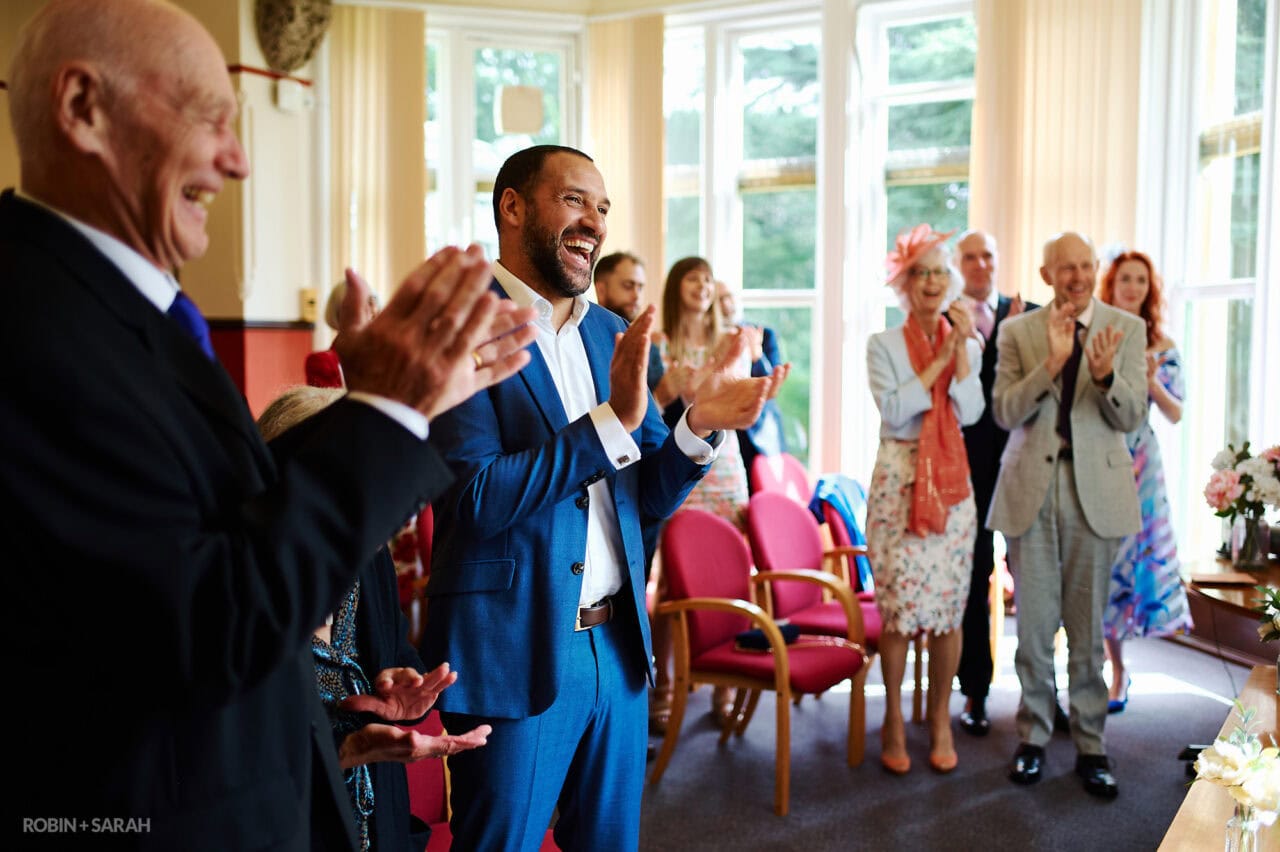 Guests clap at end of wedding ceremony at The Elgar Room