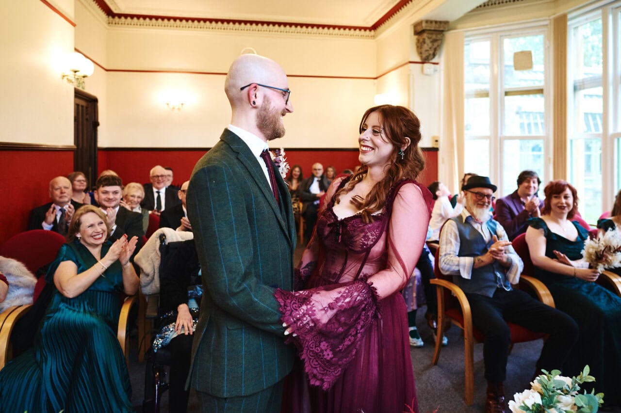 Guests clap during wedding ceremony