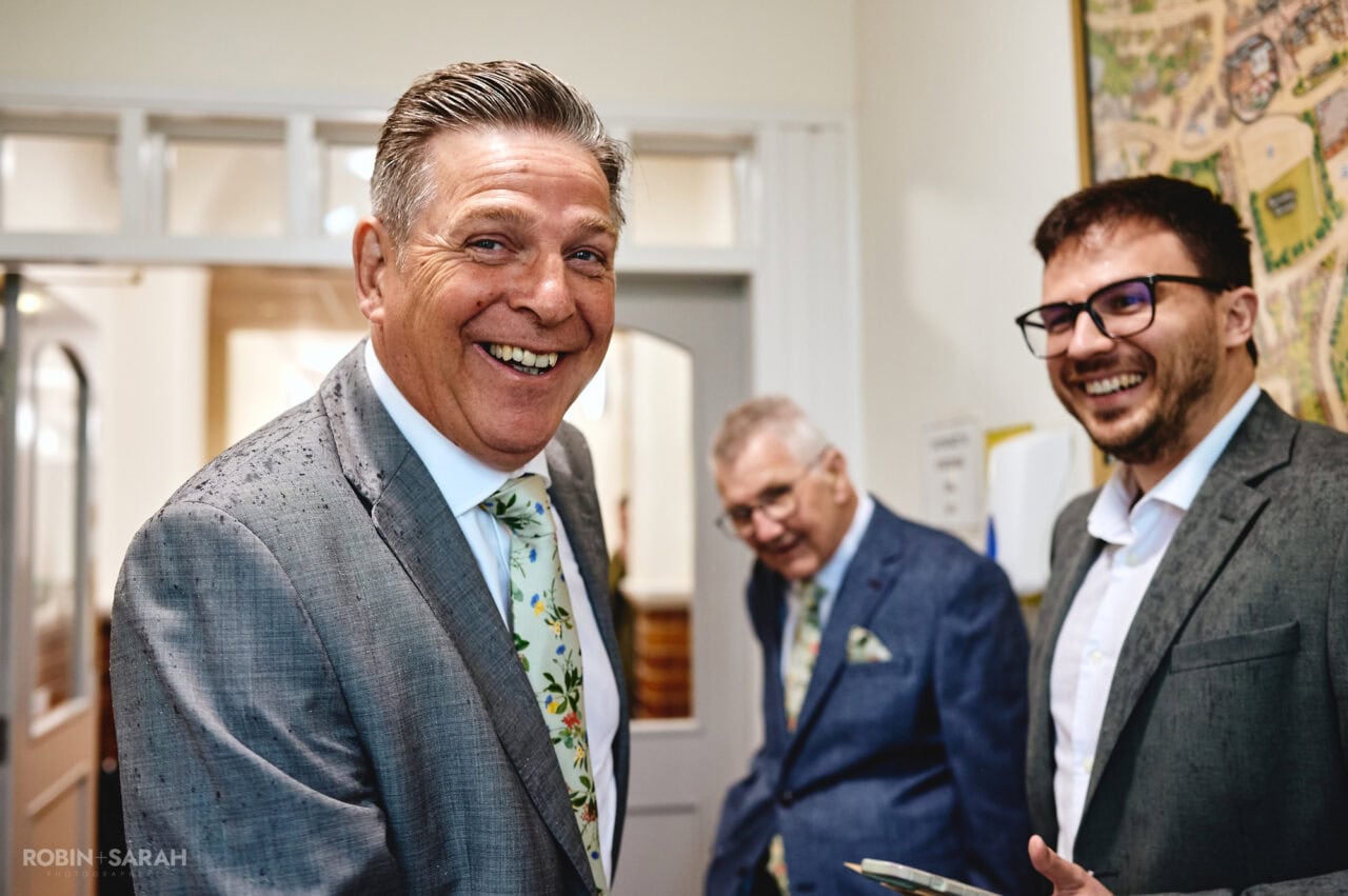 Guests chat and relax as they arrive at Registry Office for wedding ceremony