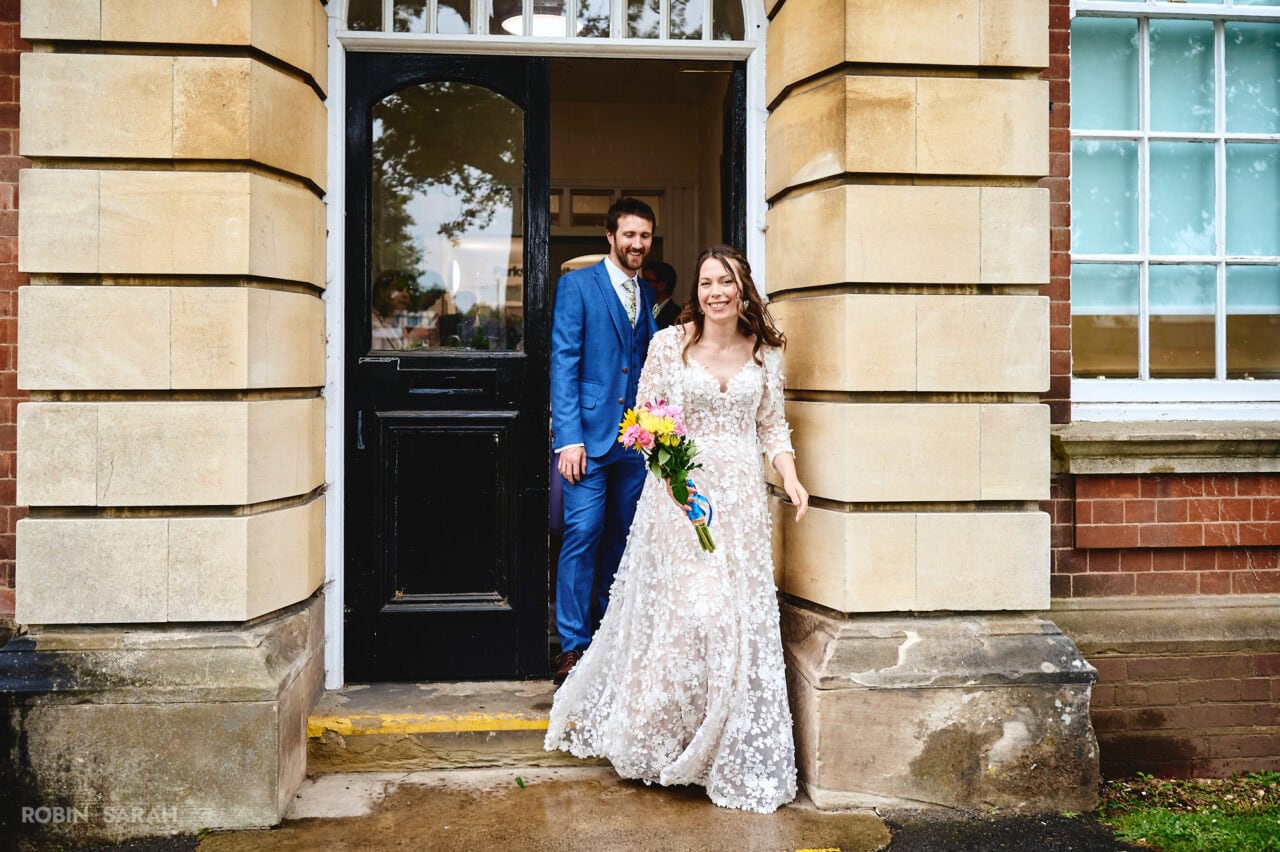 Bride and groom leave Bromsgrove Registry Office after wedding ceremony