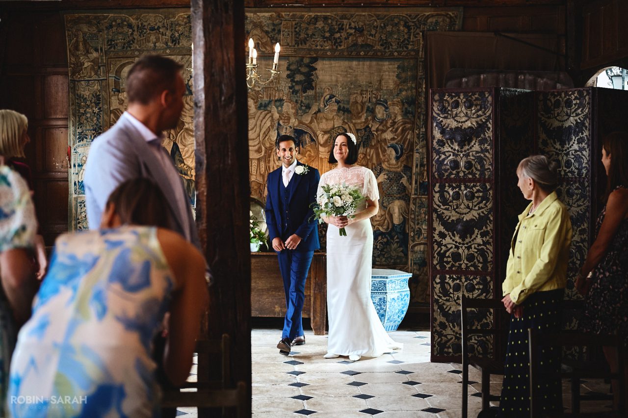 Bride and groom enter wedding ceremony together