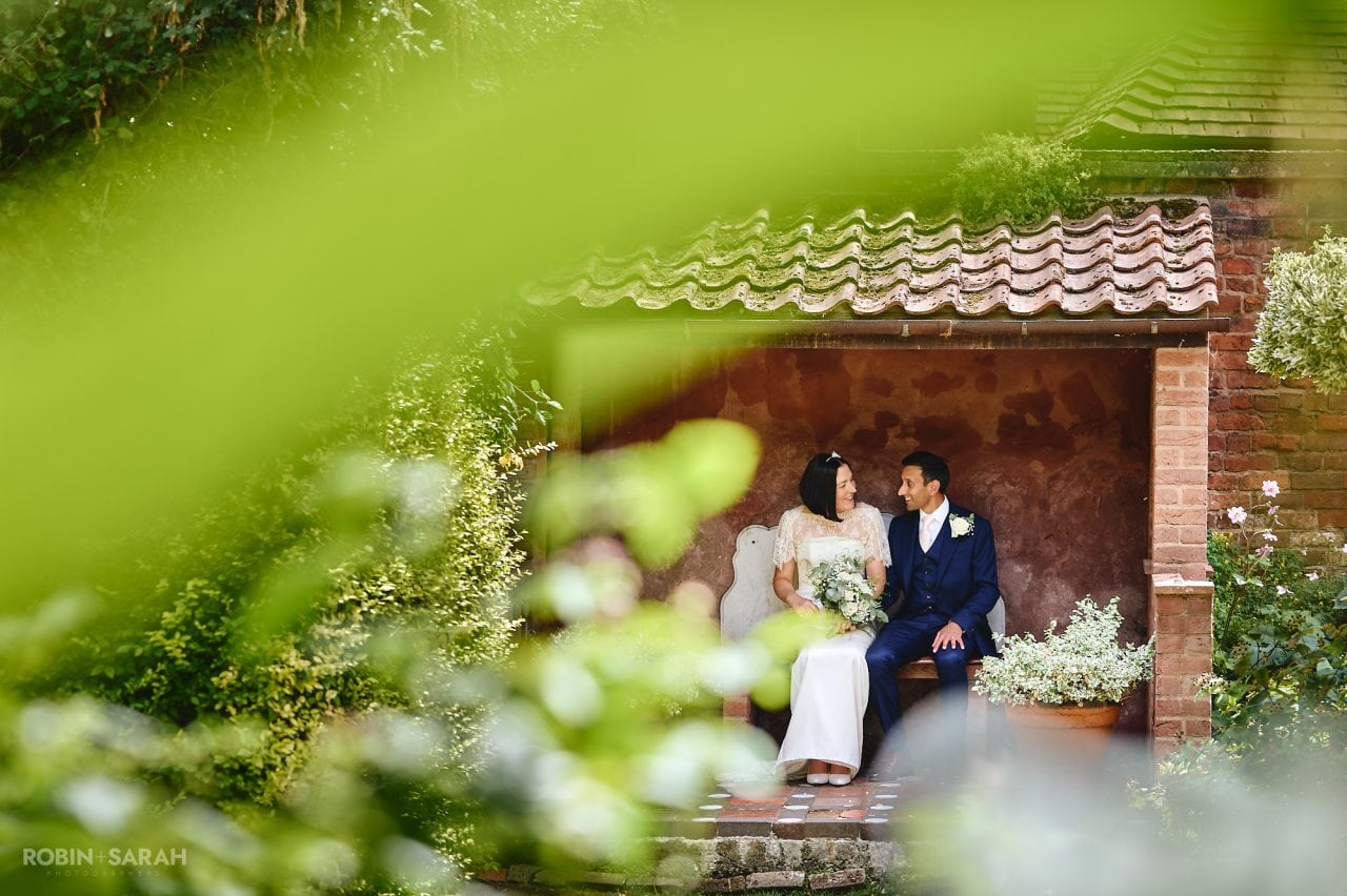 Bride and groom enjoying some time alone in gardens at Greyfriars