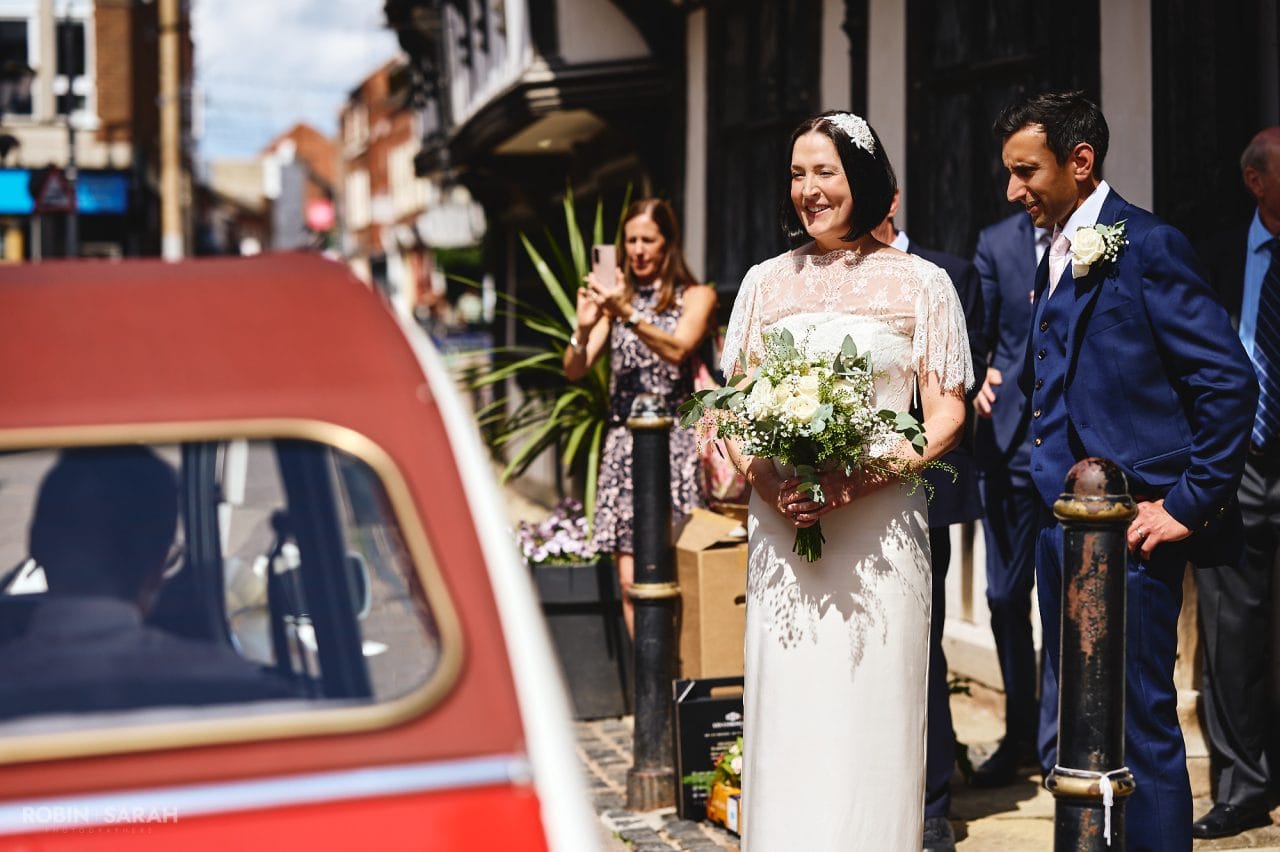 Beautiful bride holding a bouquet of white roses outsider Greyfriars in Worcester