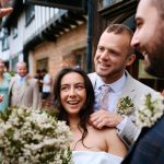 Bride, groom and friends after wedding ceremony