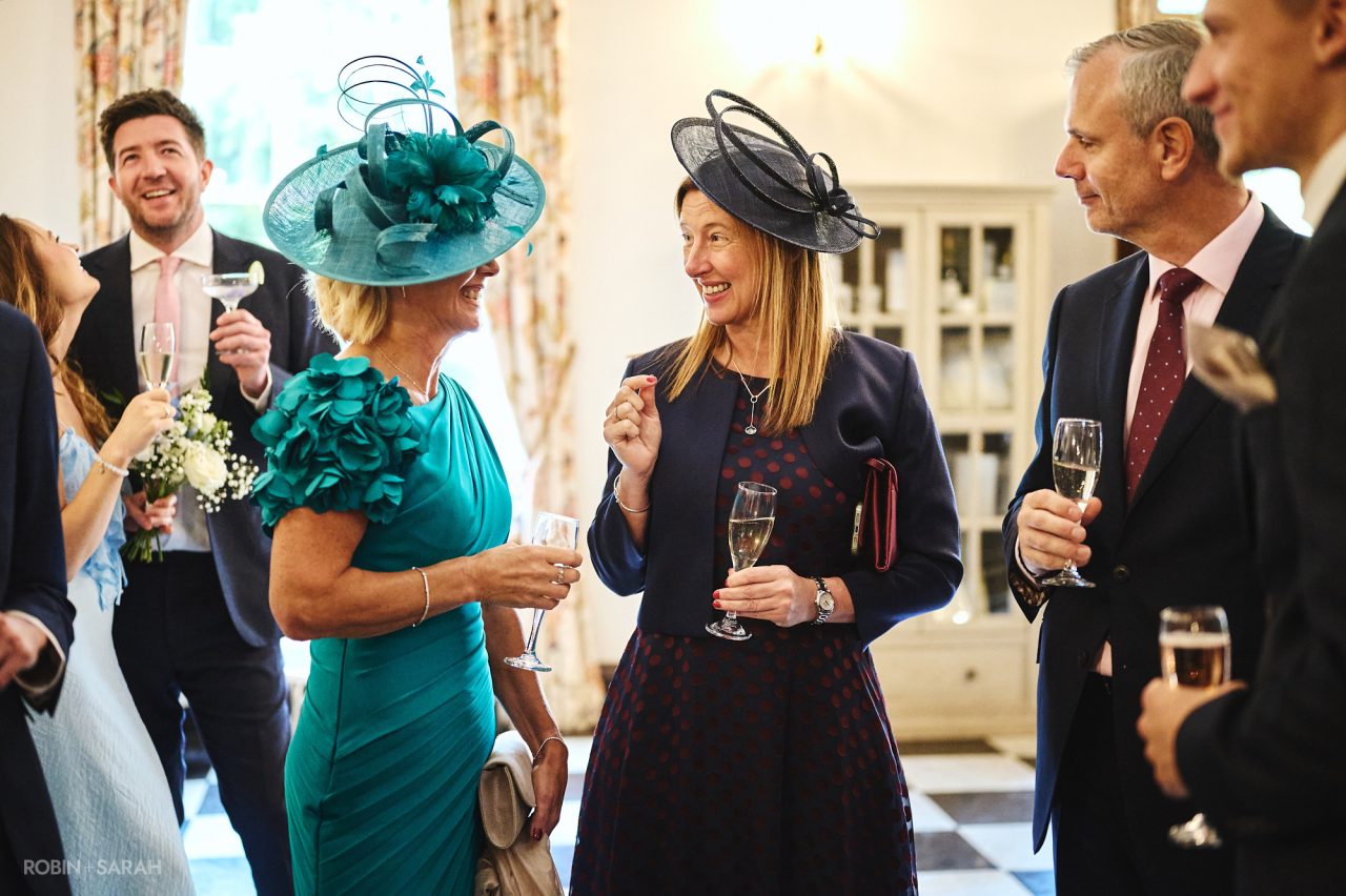Guests enjoying the drinks reception during wedding at Bourton Hall