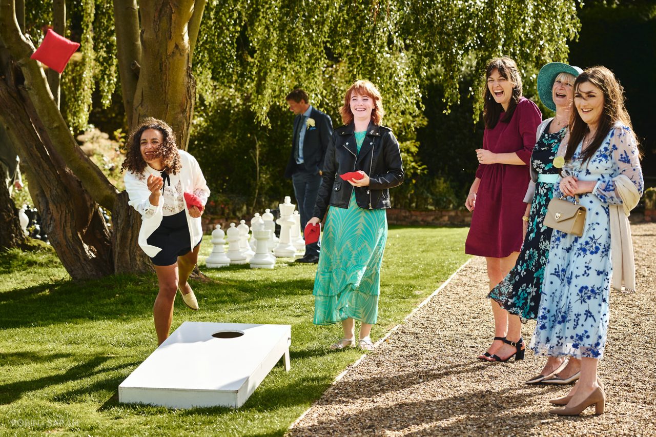 Wedding guests playing lawn games at Bourton Hall