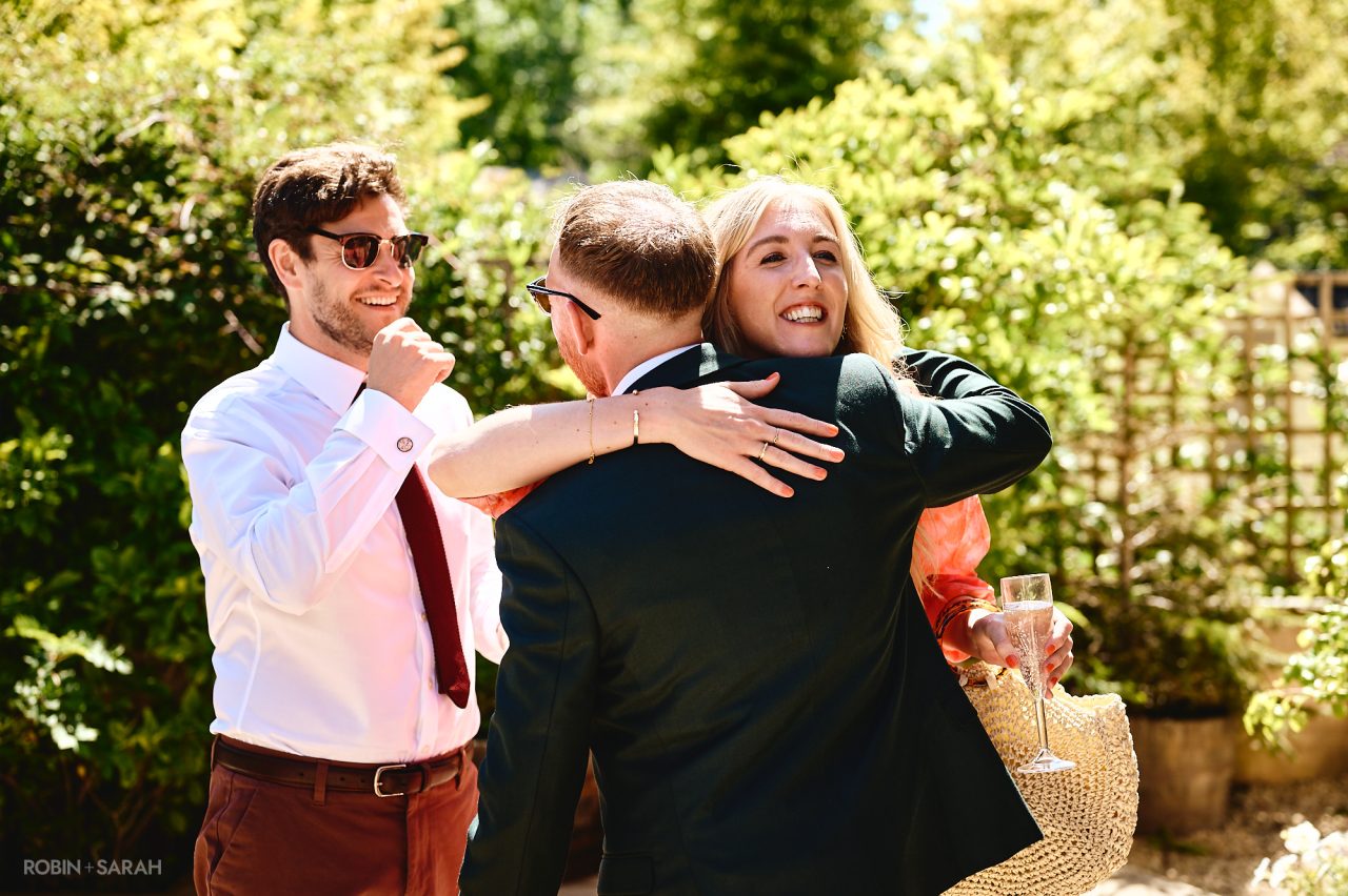 Wedding guests arrive at Charingworth House and are greeted by groom