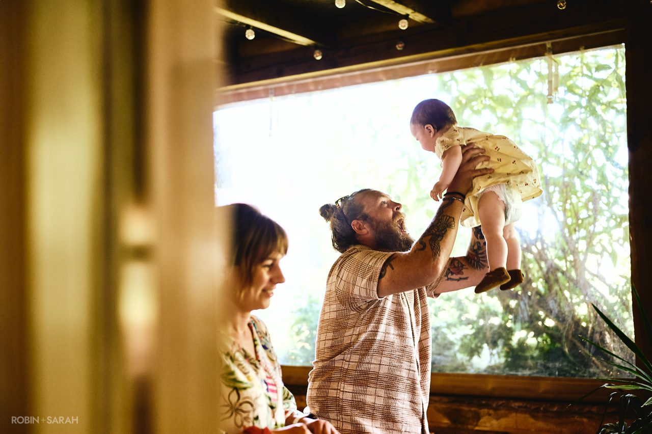 Wedding guest plays with baby