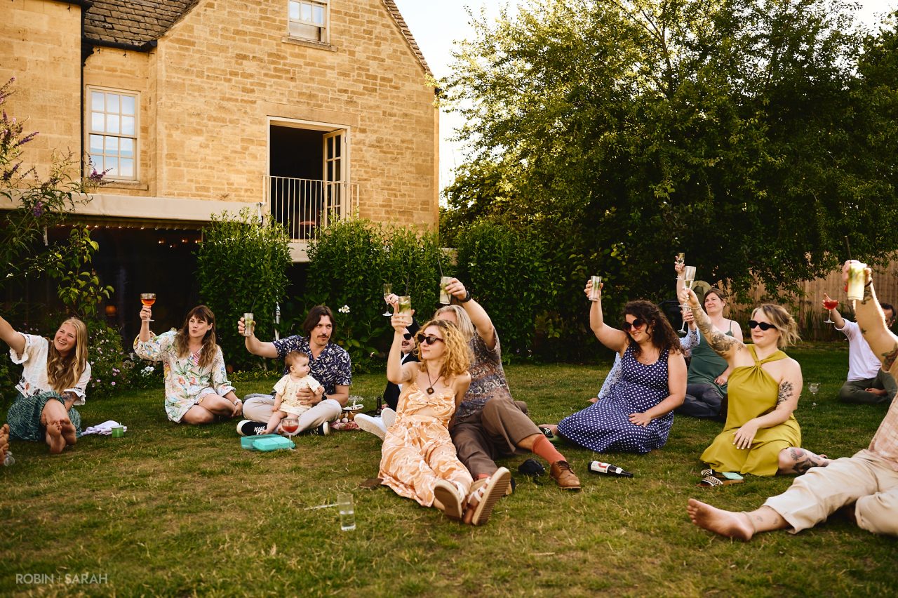 Wedding speeches outside in the gardens at Charingworth House