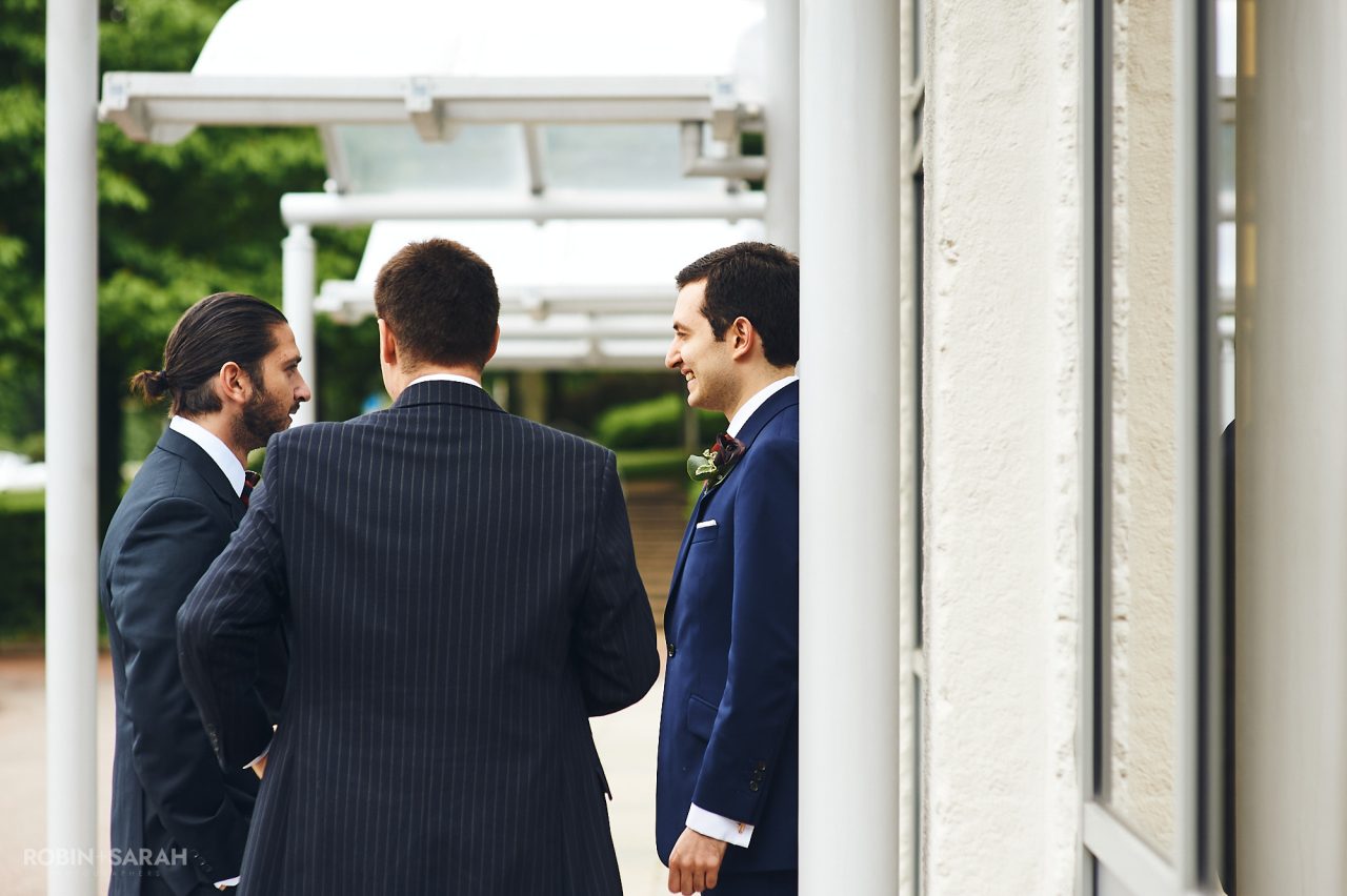 Groom and groomsmen arrive at Solihull Register Office for wedding