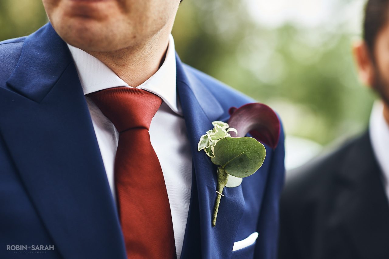 Detail of groom's buttonhole flower