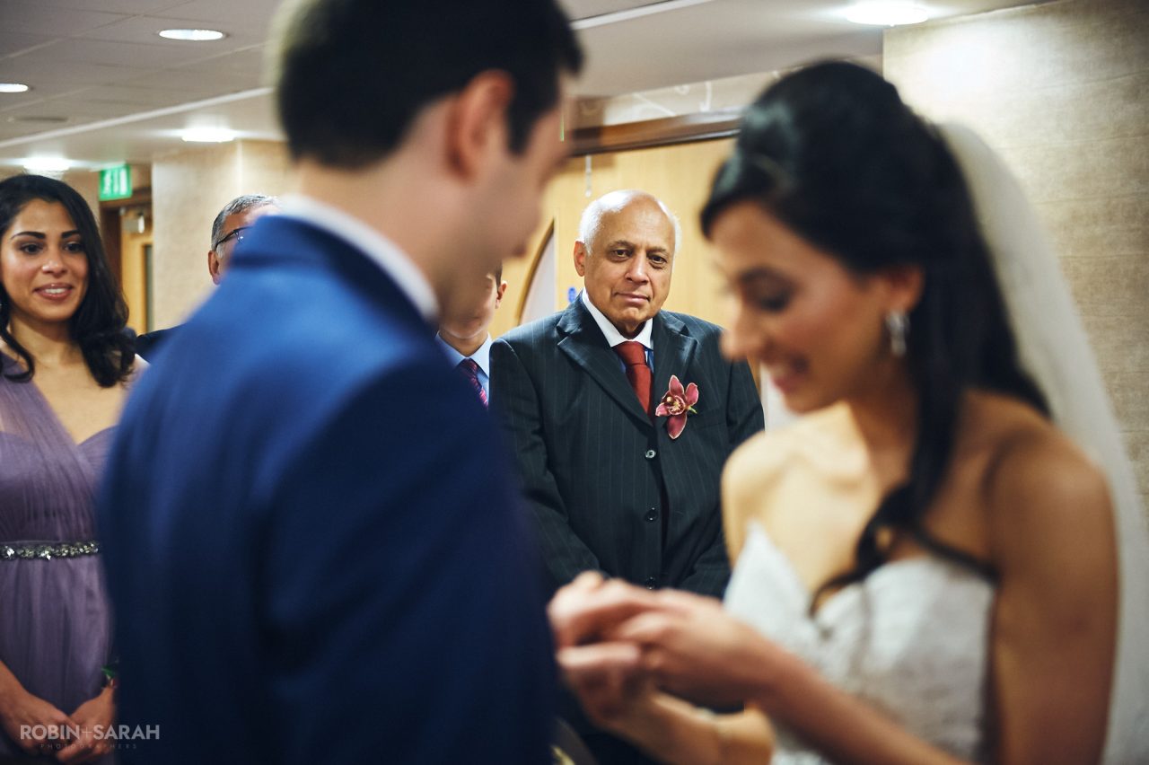 Bride's dad and sister watch as wedding ceremony takes place at Solihull Register Office