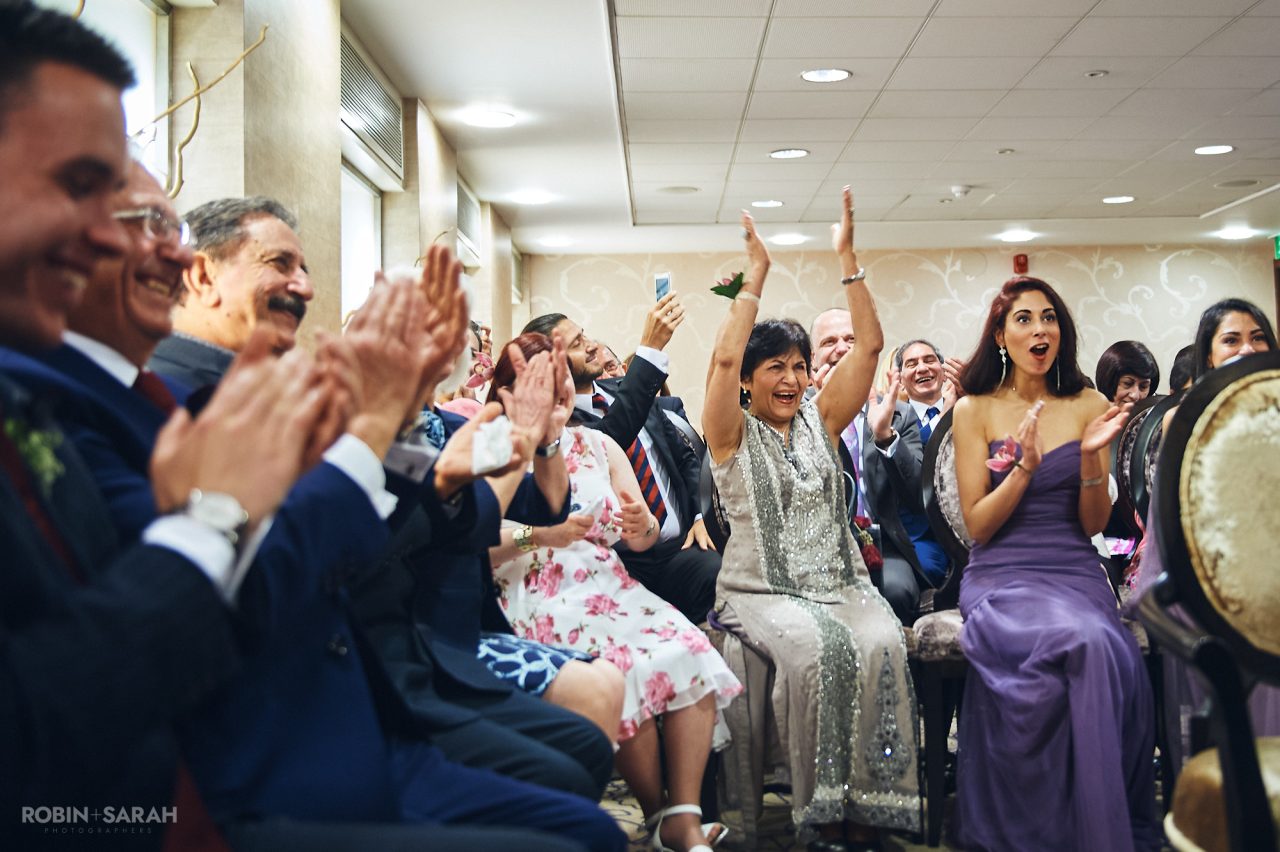 Wedding guests clap and cheer at Solihull Register Office