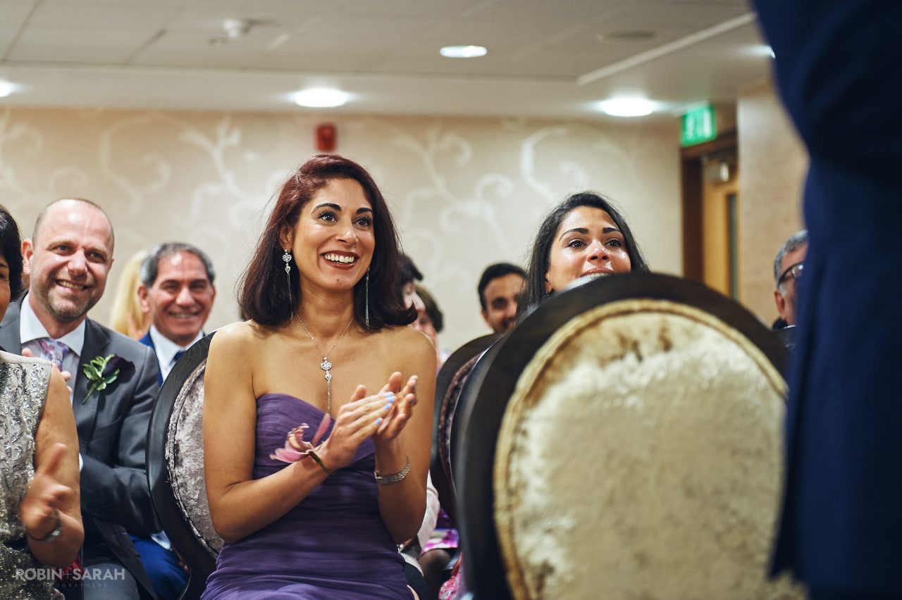 Bridesmaids clapping and emotional during wedding ceremony at Solihull Register Office