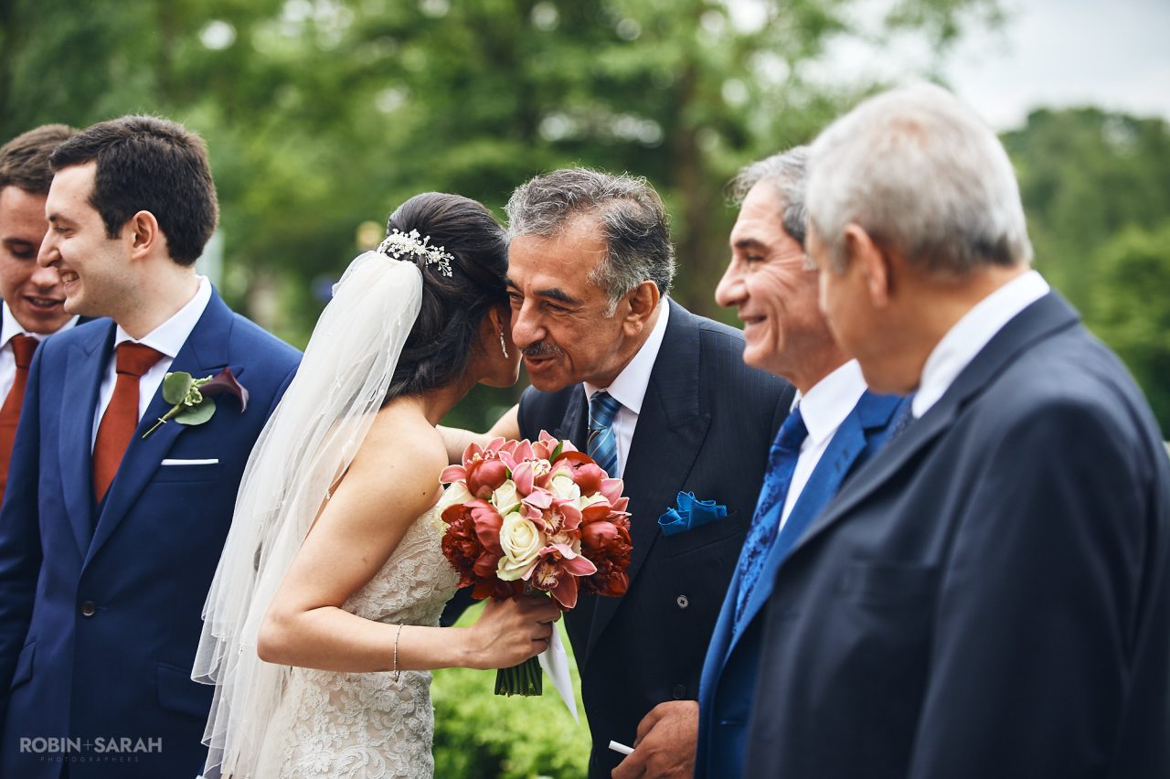 Bride congratulated by wedding guests outside Solihull Register Office